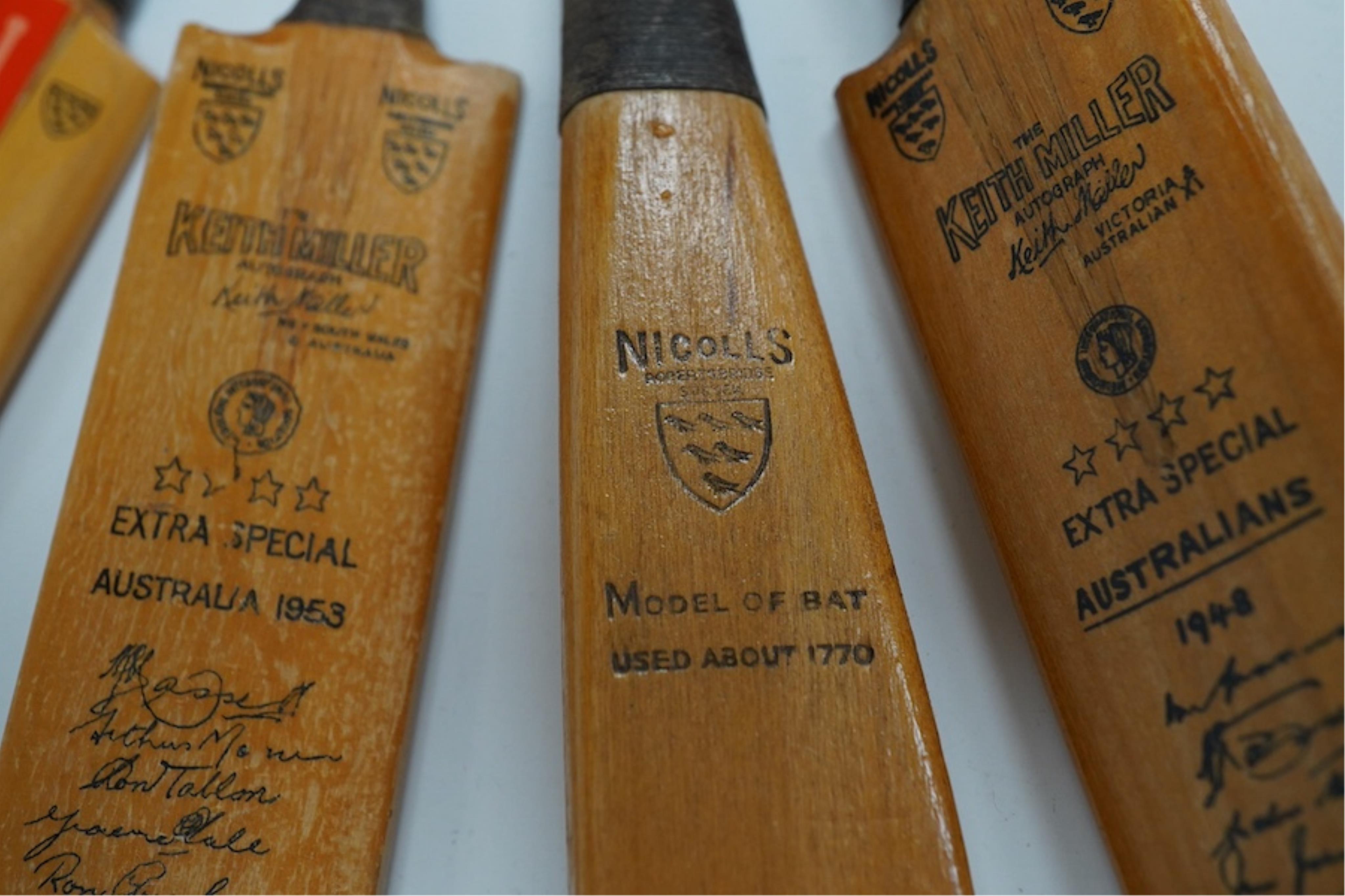 Four miniature model cricket bats, one signed, others printed. Condition - fair to good